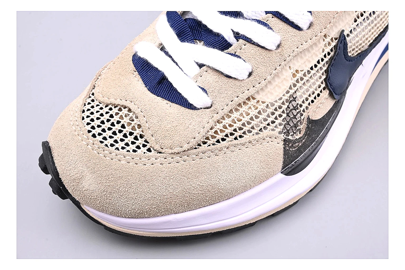 Nike Retro Runner Beige Blue QC reference photo showing beige suede-mesh runner upper, blue accent panels, low retro profile, and cushioned running sole thumbnail 4