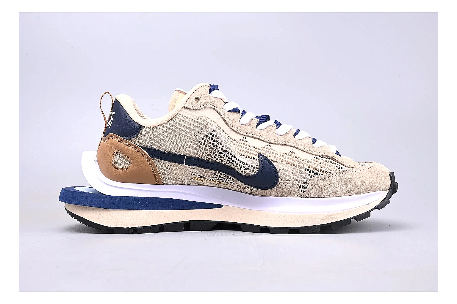 Nike Retro Runner Beige Blue QC reference photo showing beige suede-mesh runner upper, blue accent panels, low retro profile, and cushioned running sole thumbnail 5