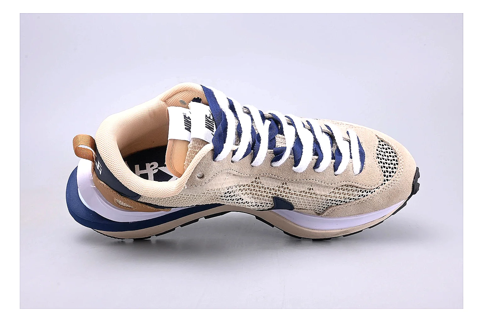Nike Retro Runner Beige Blue QC reference photo showing beige suede-mesh runner upper, blue accent panels, low retro profile, and cushioned running sole thumbnail 6