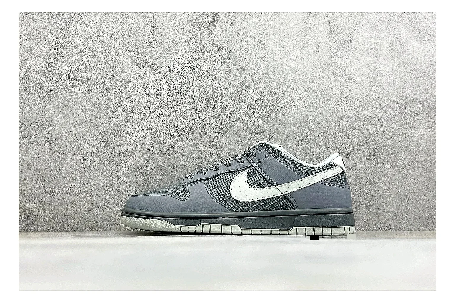 Nike SB Dunk Low Grey QC reference photo showing grey low-top skate upper, white Swoosh, padded collar, and classic Dunk sole