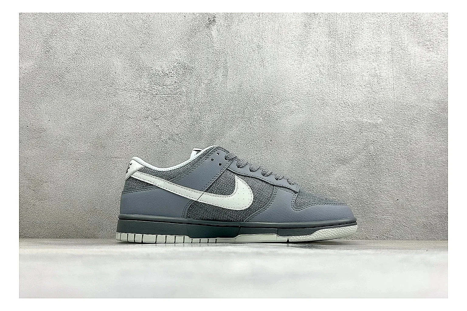 Nike SB Dunk Low Grey QC reference photo showing grey low-top skate upper, white Swoosh, padded collar, and classic Dunk sole thumbnail 5