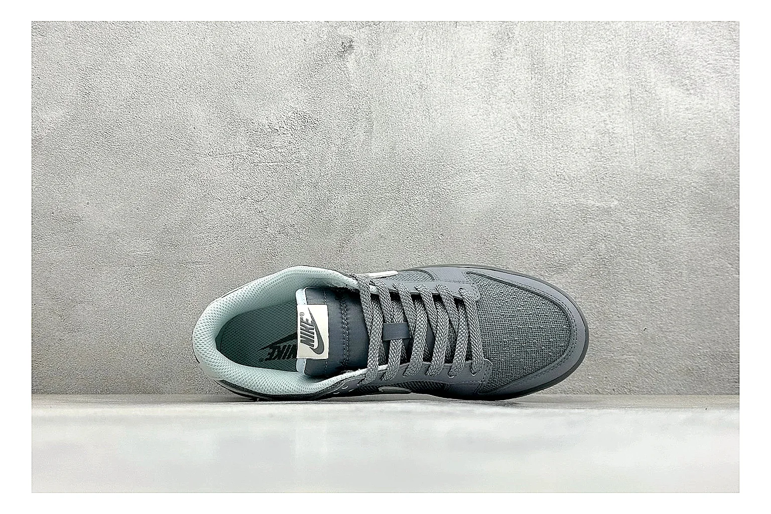 Nike SB Dunk Low Grey QC reference photo showing grey low-top skate upper, white Swoosh, padded collar, and classic Dunk sole thumbnail 6