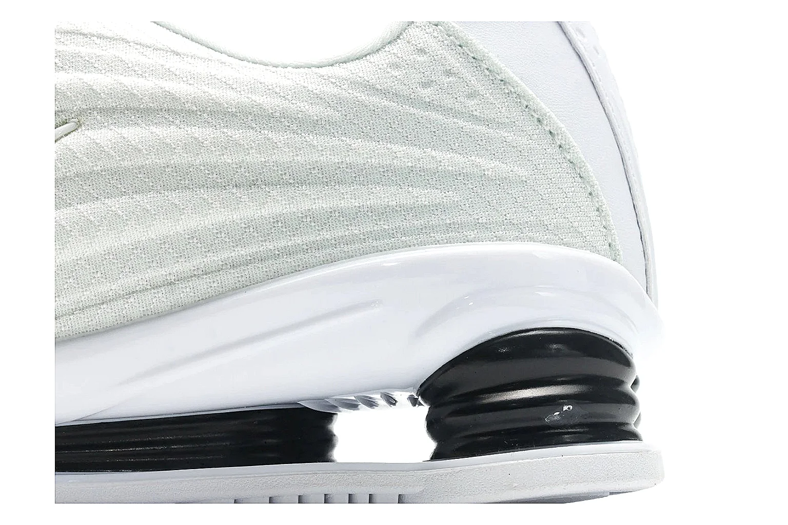 Nike Shox Z White Sneakers QC reference photo showing white streamlined layered upper, small Swoosh, black heel cushioning columns, and modern low runner shape thumbnail 4
