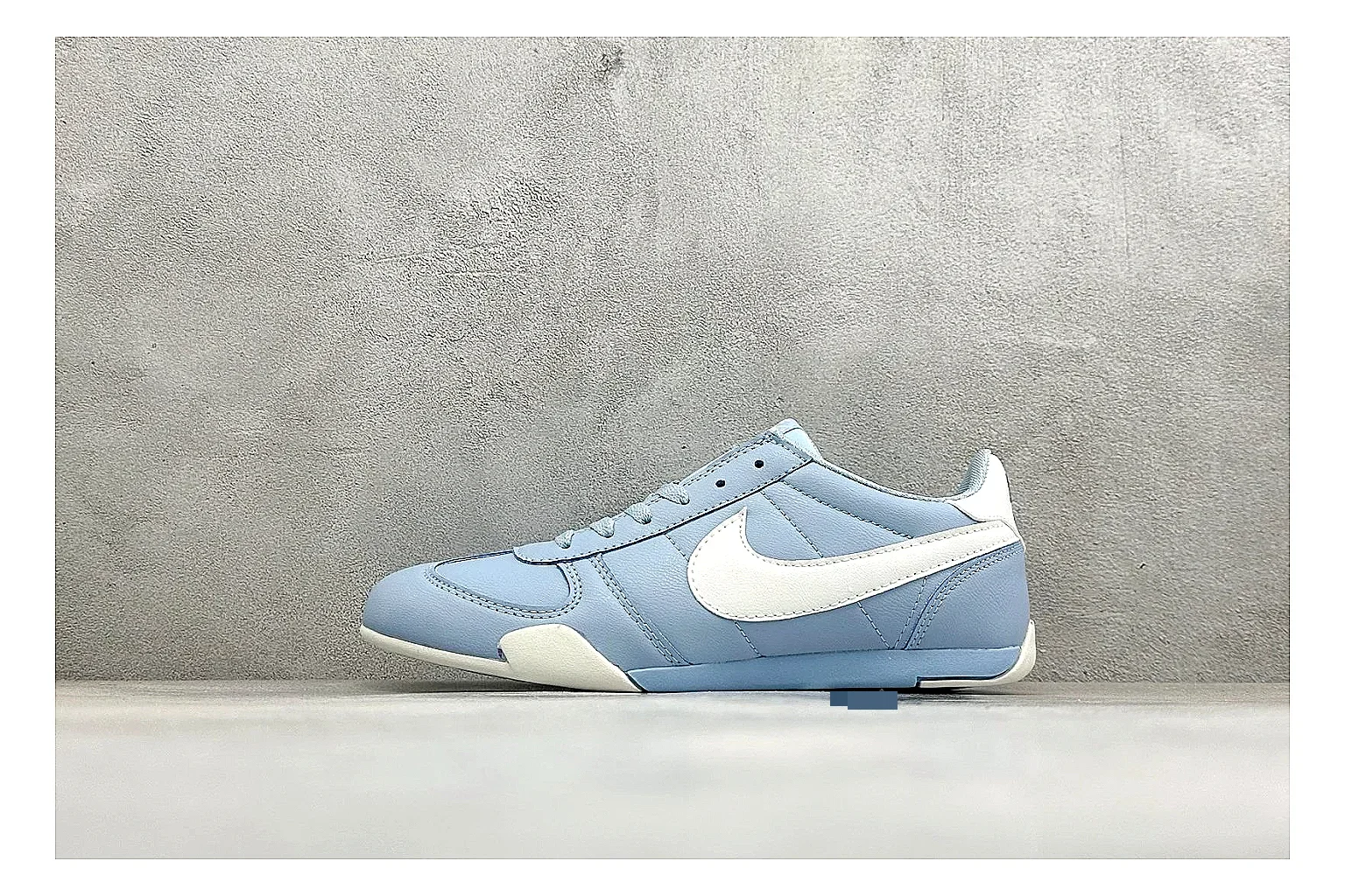 Nike Sprint Sister Light Blue QC reference photo showing light blue retro-runner upper, slim side profile, tonal panels, and low everyday sole