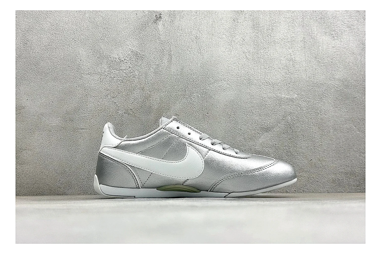 Nike Sprint Sister Silver QC reference photo showing silver retro-runner upper, slim low-top shape, layered side panels, and a light everyday sole thumbnail 5
