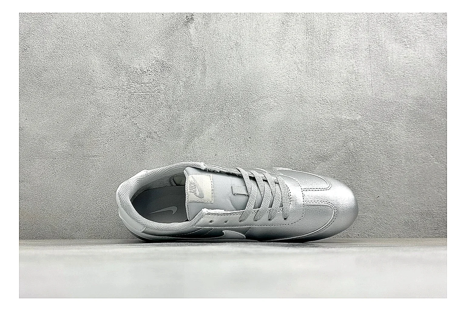 Nike Sprint Sister Silver QC reference photo showing silver retro-runner upper, slim low-top shape, layered side panels, and a light everyday sole thumbnail 6
