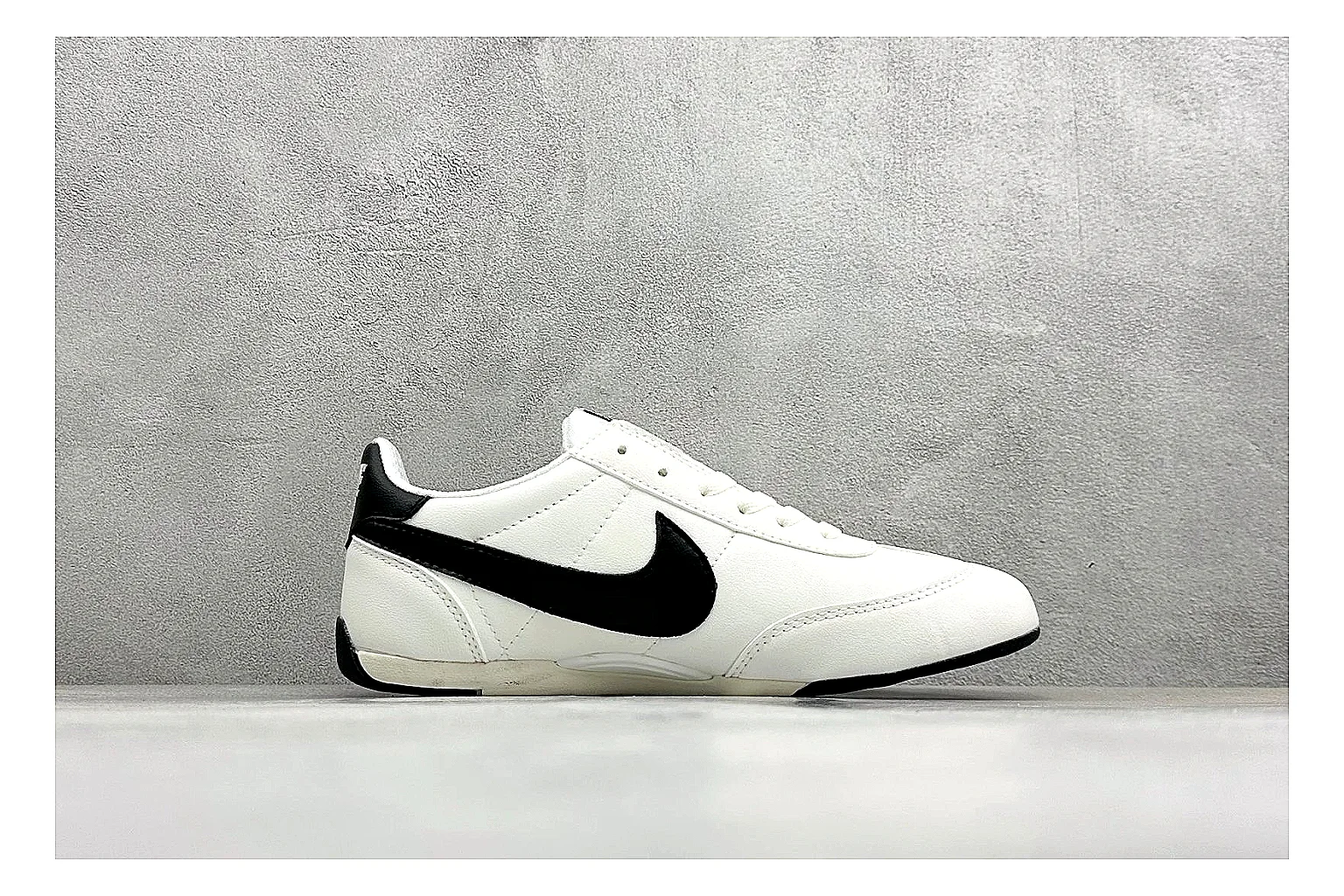 Nike Sprint Sister White Black QC reference photo showing white retro-runner upper, black Swoosh contrast, slim low-top profile, and light casual sole thumbnail 5