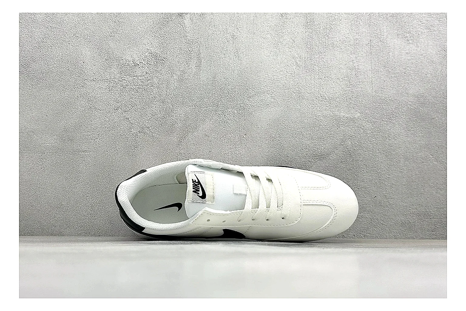 Nike Sprint Sister White Black QC reference photo showing white retro-runner upper, black Swoosh contrast, slim low-top profile, and light casual sole thumbnail 6