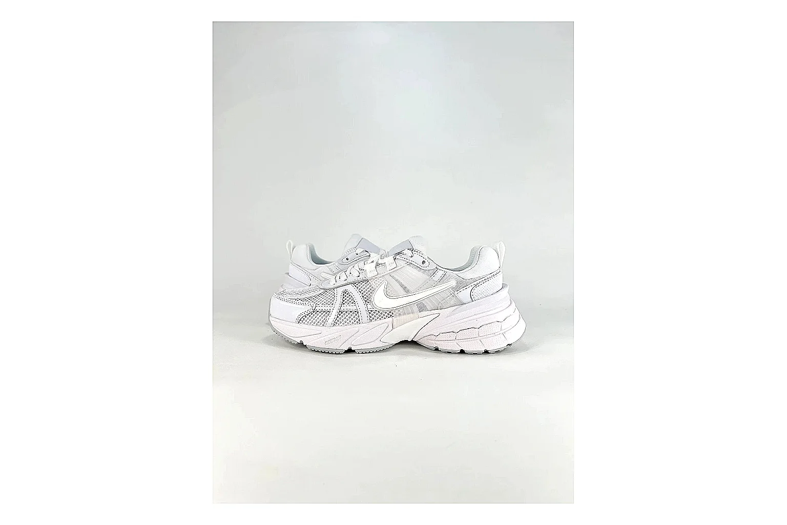 Nike V2K Run White Sneakers QC photo reference showing white retro runner sneakers with mesh-leather texture, side-profile shape, upper panel lines, and outsole detail