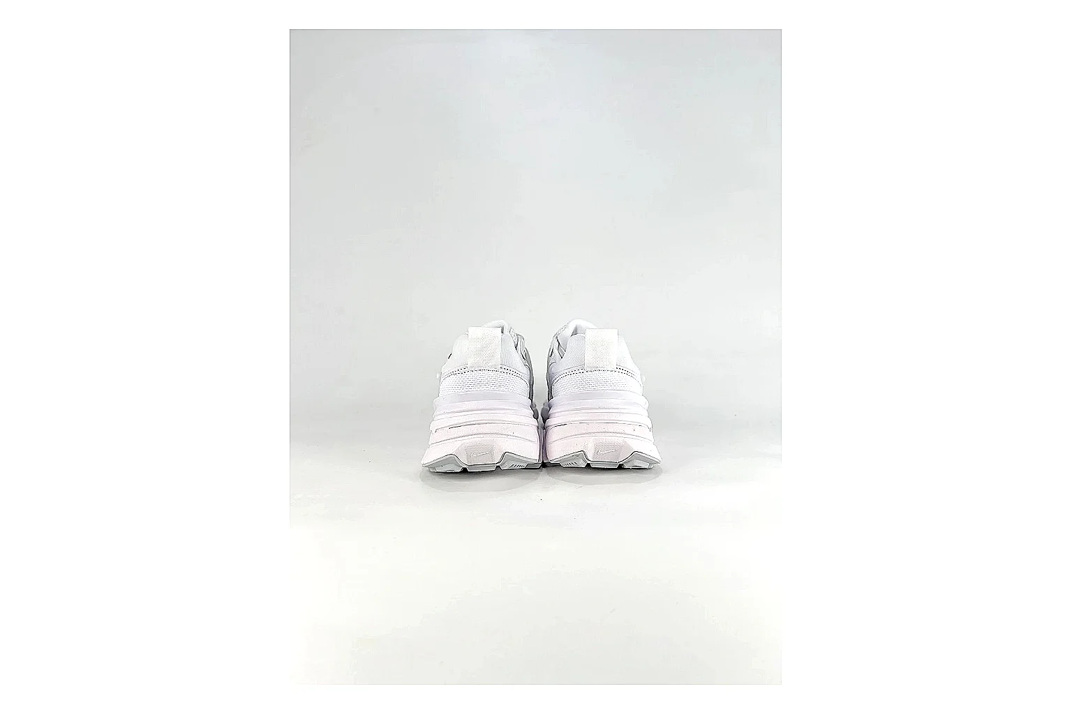 Nike V2K Run White Sneakers QC photo reference showing white retro runner sneakers with mesh-leather texture, side-profile shape, upper panel lines, and outsole detail