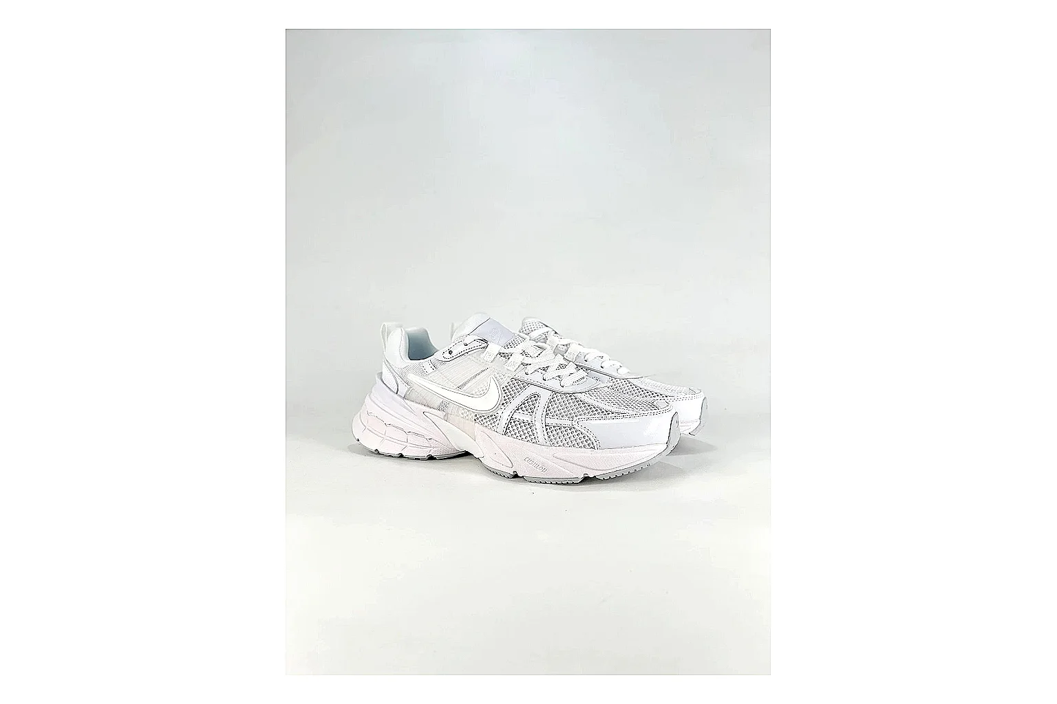 Nike V2K Run White Sneakers QC photo reference showing white retro runner sneakers with mesh-leather texture, side-profile shape, upper panel lines, and outsole detail thumbnail 5