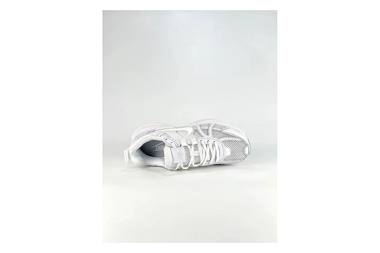 Nike V2K Run White Sneakers QC photo reference showing white retro runner sneakers with mesh-leather texture, side-profile shape, upper panel lines, and outsole detail thumbnail 6