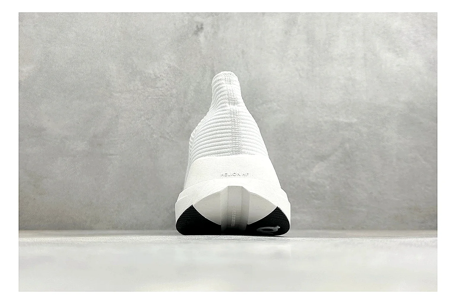 On Cloudboom White Black QC reference photo showing white performance mesh, black contrast details, slim racing profile, and segmented CloudTec sole