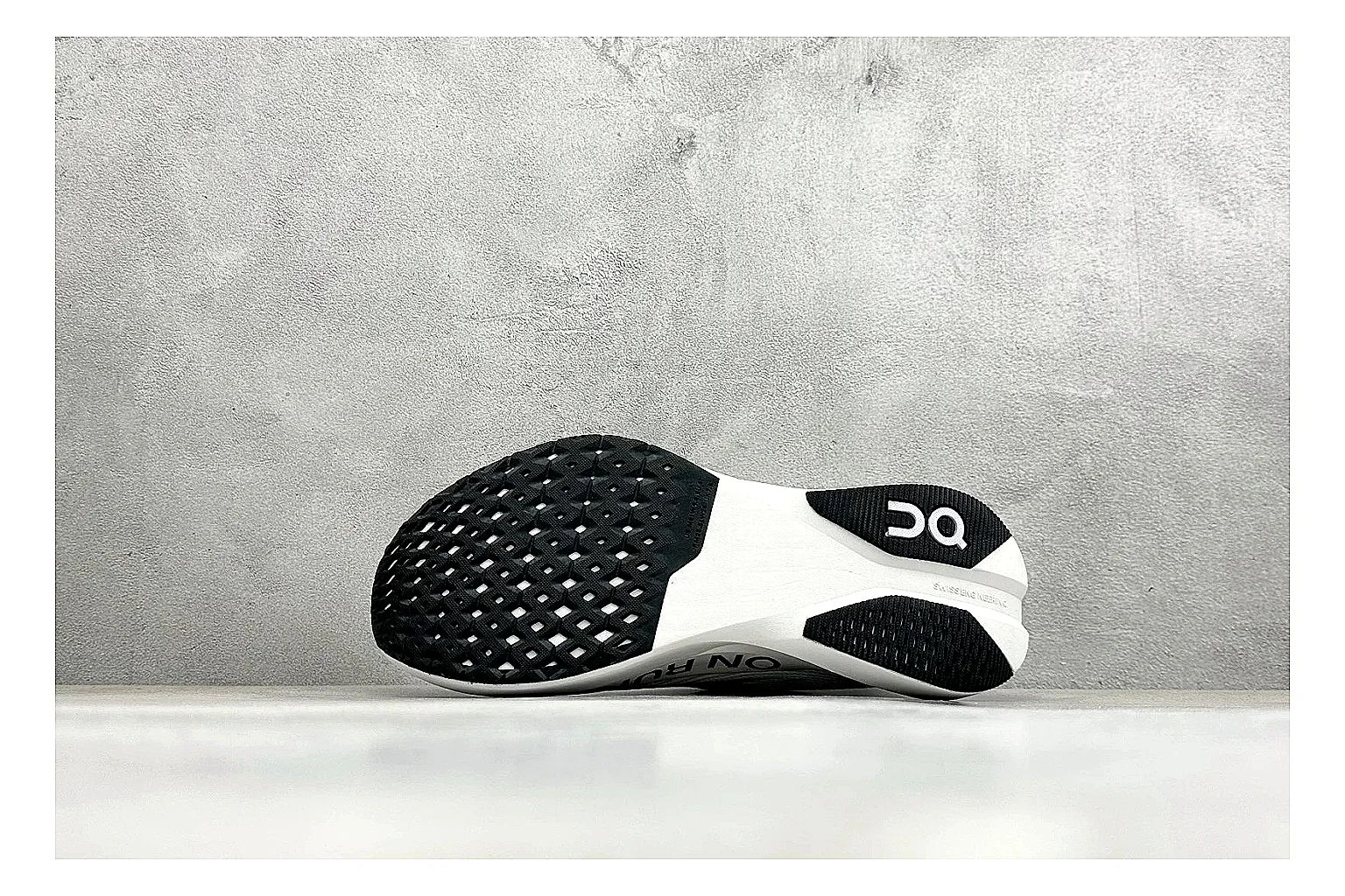 On Cloudboom White Black QC reference photo showing white performance mesh, black contrast details, slim racing profile, and segmented CloudTec sole thumbnail 3