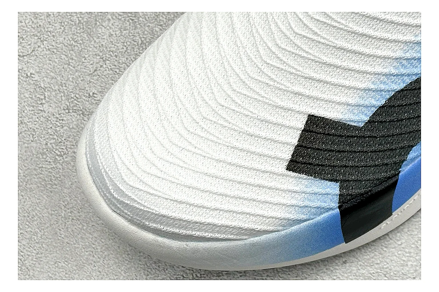 On Cloudboom White Blue QC reference photo showing white performance mesh, blue gradient accents, slim racing profile, and segmented CloudTec sole thumbnail 4