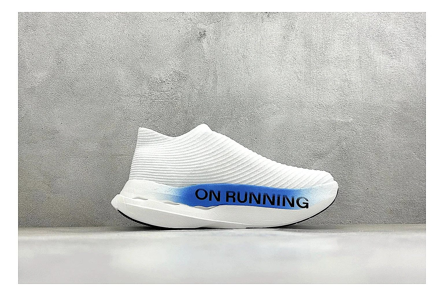 On Cloudboom White Blue QC reference photo showing white performance mesh, blue gradient accents, slim racing profile, and segmented CloudTec sole thumbnail 5
