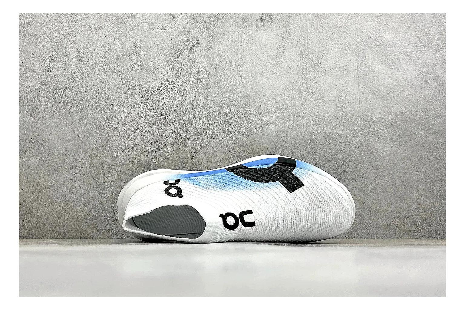 On Cloudboom White Blue QC reference photo showing white performance mesh, blue gradient accents, slim racing profile, and segmented CloudTec sole thumbnail 6