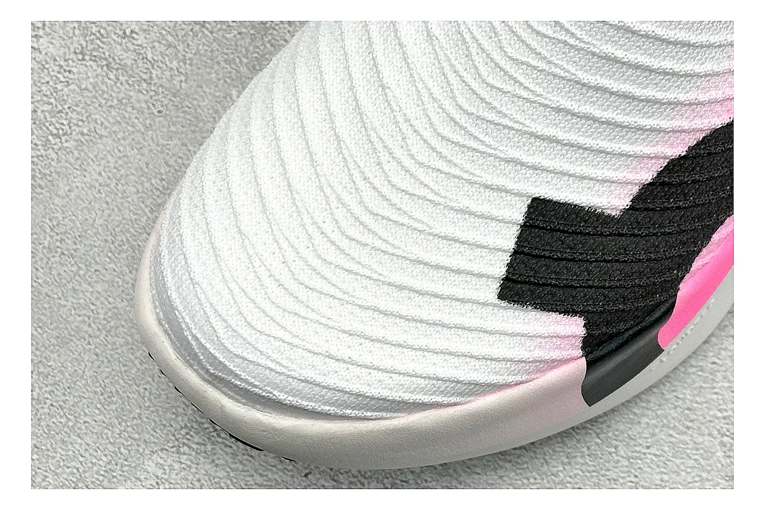 On Cloudboom White Pink QC reference photo showing white running mesh, pink gradient accents, low racing shape, and segmented CloudTec sole thumbnail 4