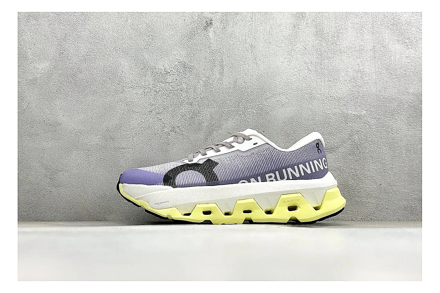 On Cloudmonster Lavender Lime QC reference photo showing lavender runner upper, lime accent hits, oversized CloudTec pod sole, and soft technical color mix