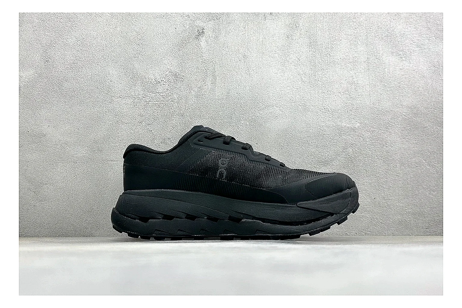 On Cloudmonster Triple Black QC reference photo showing triple black mesh upper, oversized CloudTec sole pods, tonal laces, and rounded runner shape thumbnail 5