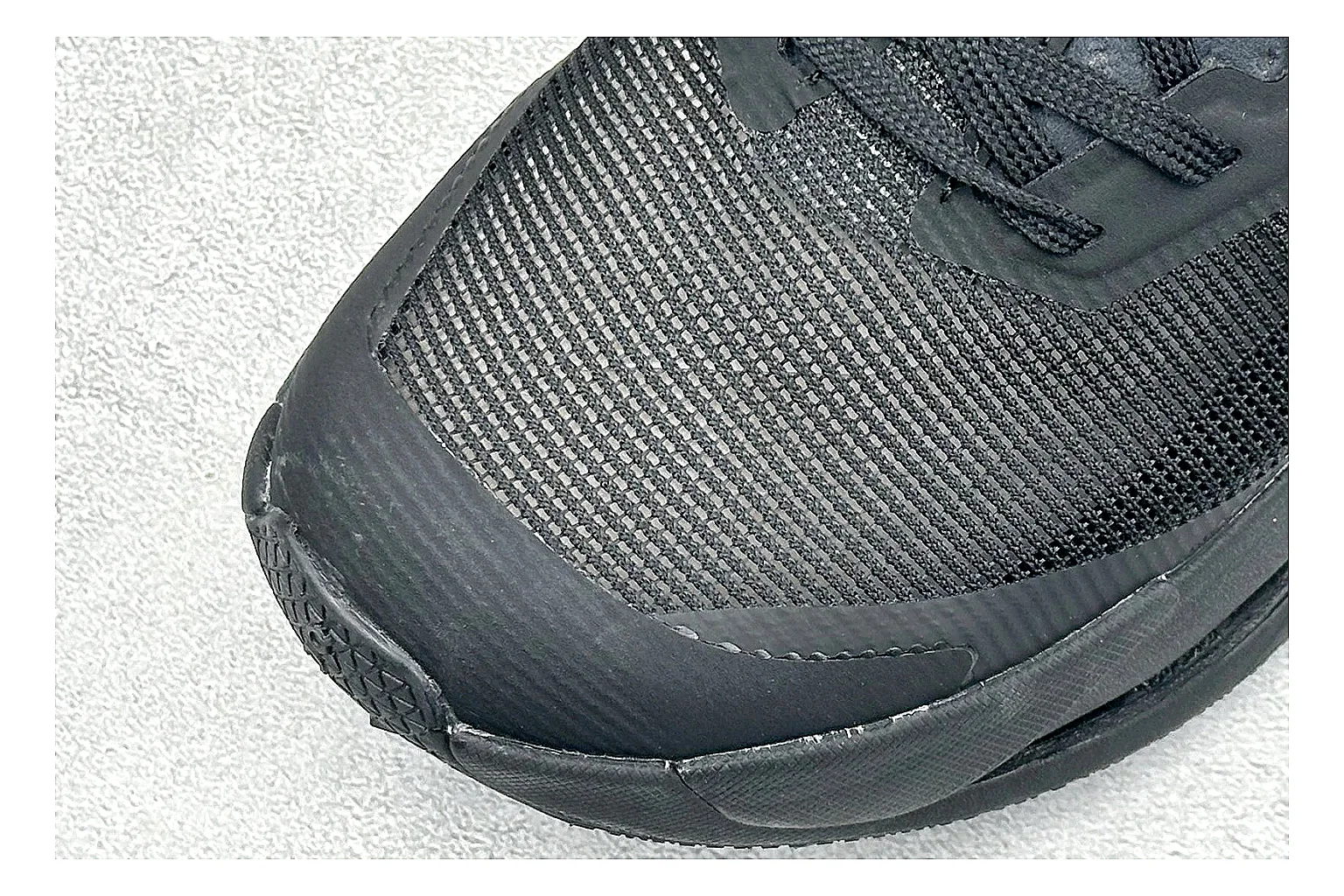 On Cloudmonster Triple Black QC reference photo showing triple black running upper, oversized CloudTec pod sole, tonal laces, and rounded performance shape thumbnail 4