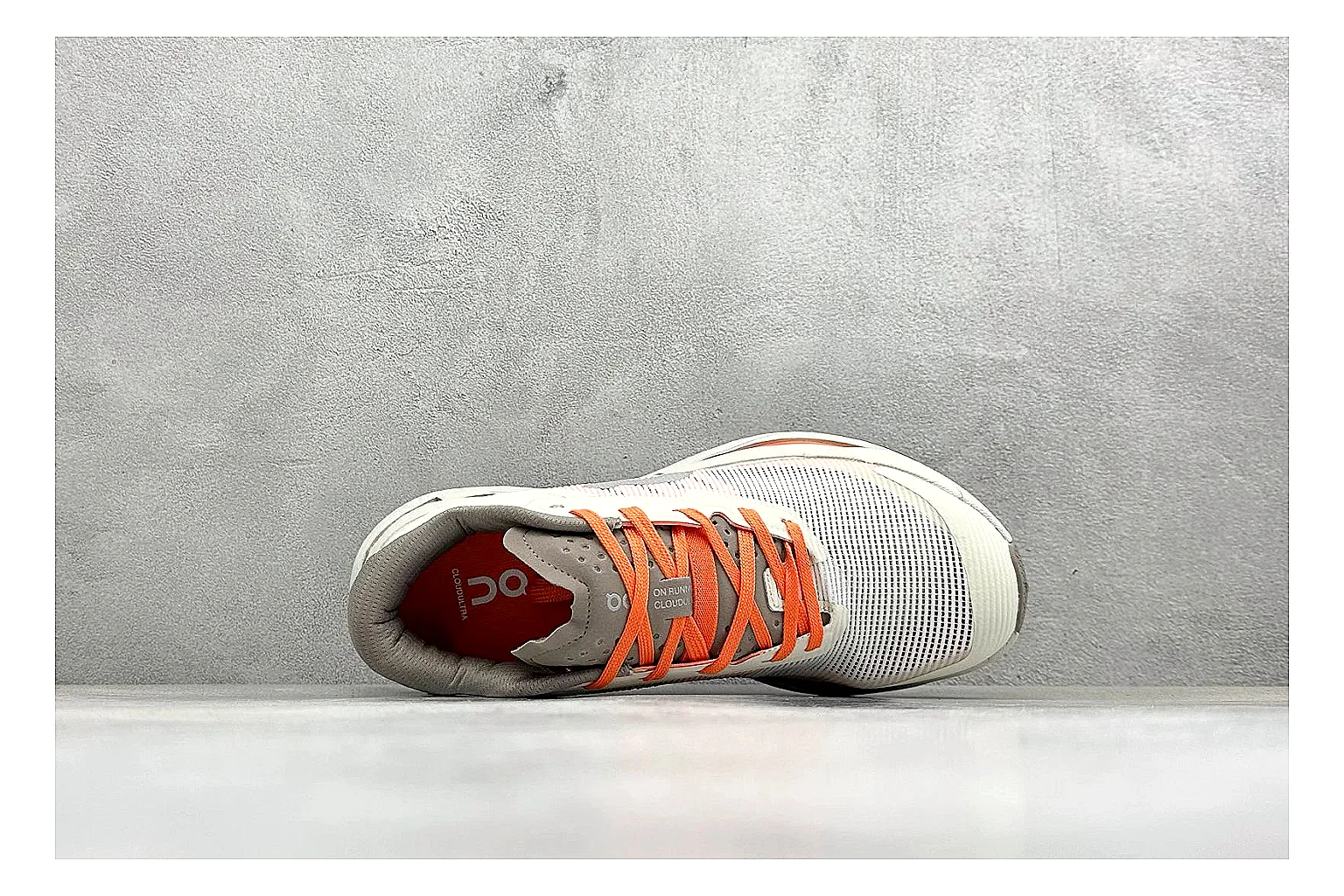 On Cloudmonster White Orange QC reference photo showing white running mesh, orange accent hits, oversized CloudTec sole pods, and a rounded runner silhouette thumbnail 6