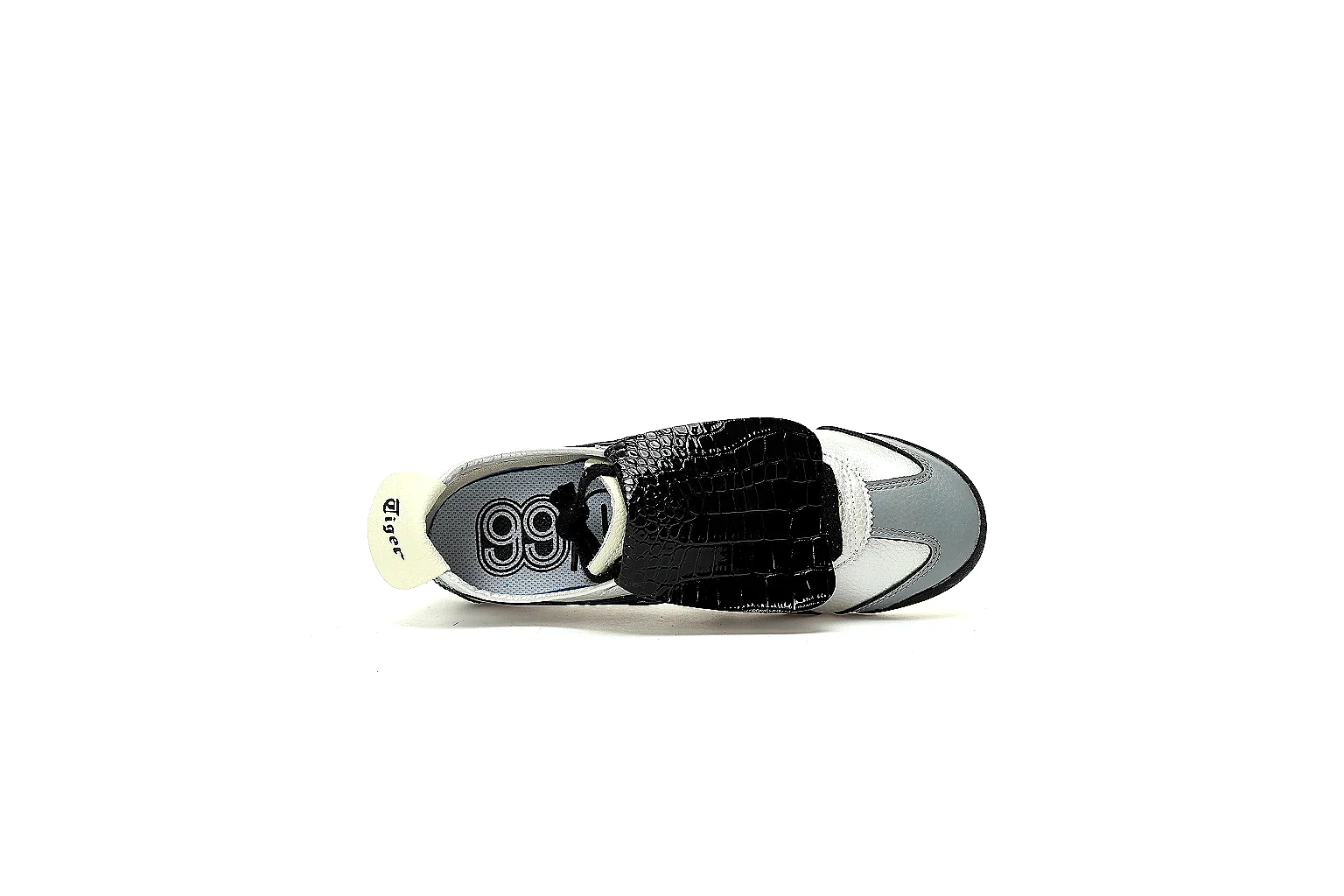 Six-angle QC gallery of white black low-tops with textured flaps and patterned rubber outsole