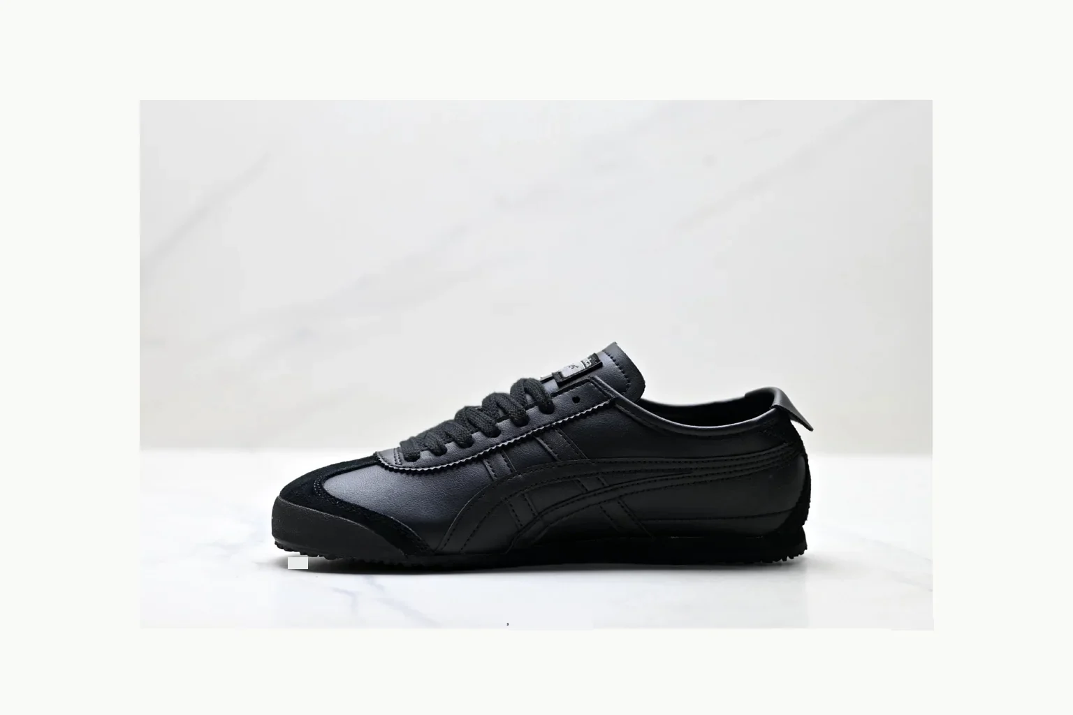 Onitsuka Tiger Black Leather Sneaker QC photo showing black black leather retro low-top with leather upper and low top shape