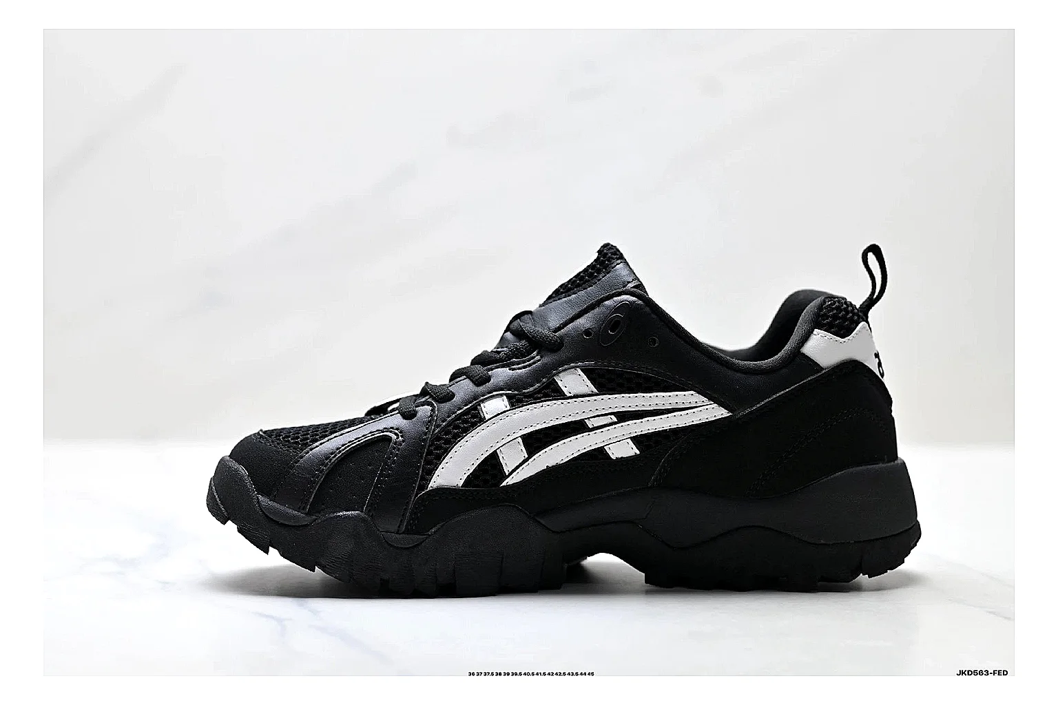 Onitsuka Tiger Gel-Tru Black White Sneakers QC photo reference showing black white trail runner sneakers with mesh-leather texture, side-profile shape, upper panel lines, and outsole detail thumbnail 5