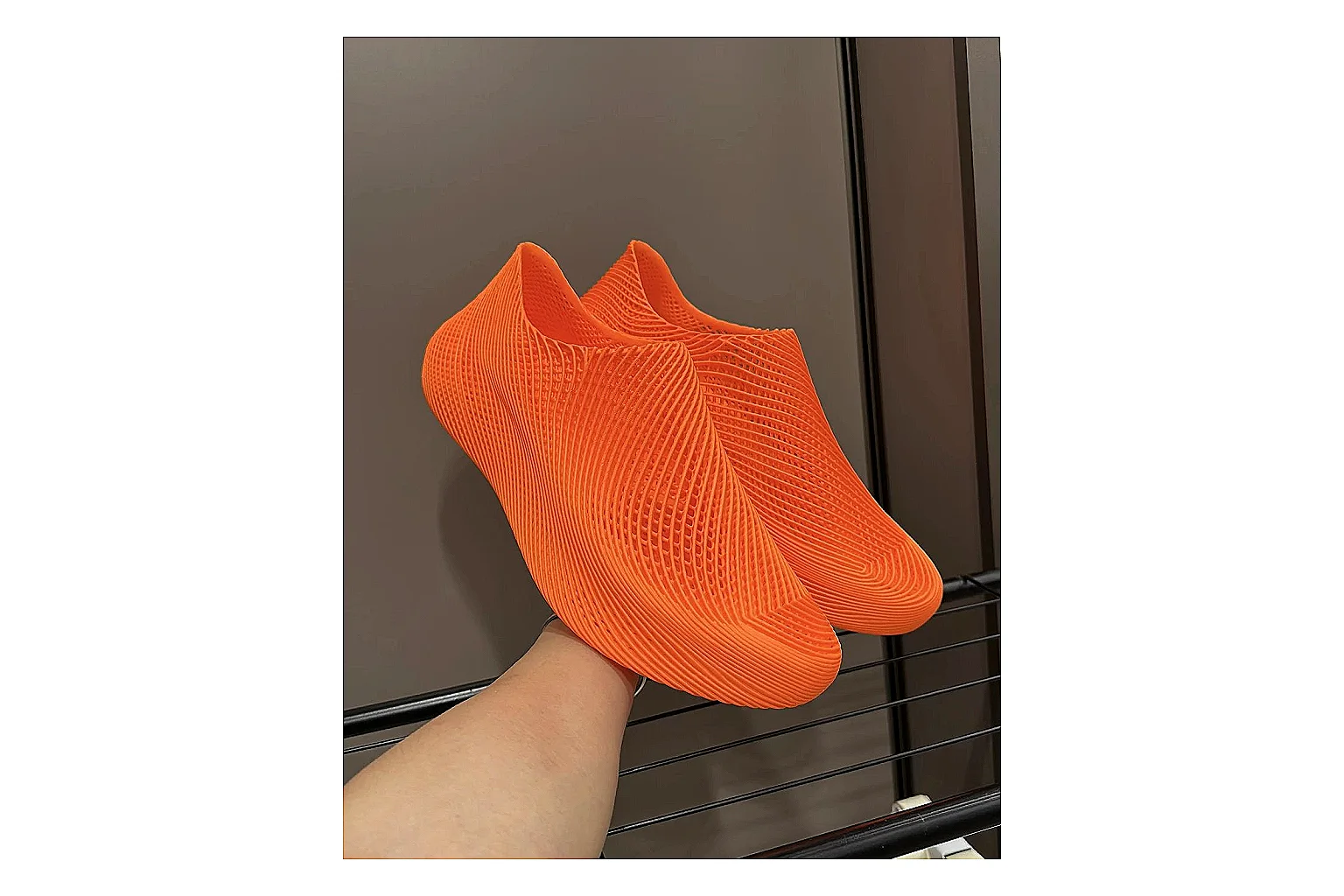Other 4D Printed Orange Slip-On Sneakers QC reference photo showing orange open-grid upper, seamless slip-on shape, sculpted sole, and futuristic lightweight profile thumbnail 2
