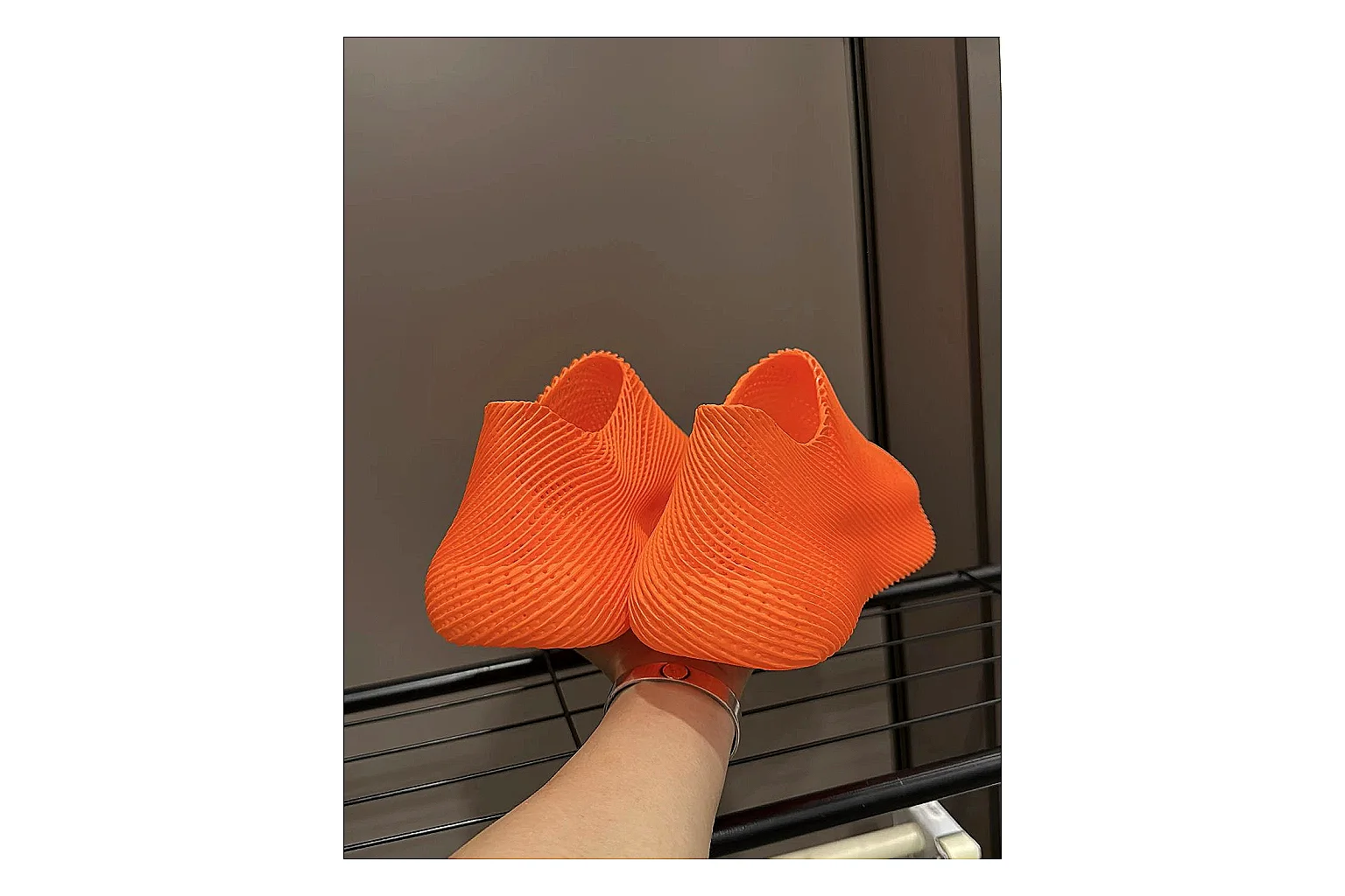 Other 4D Printed Orange Slip-On Sneakers QC reference photo showing orange open-grid upper, seamless slip-on shape, sculpted sole, and futuristic lightweight profile thumbnail 3