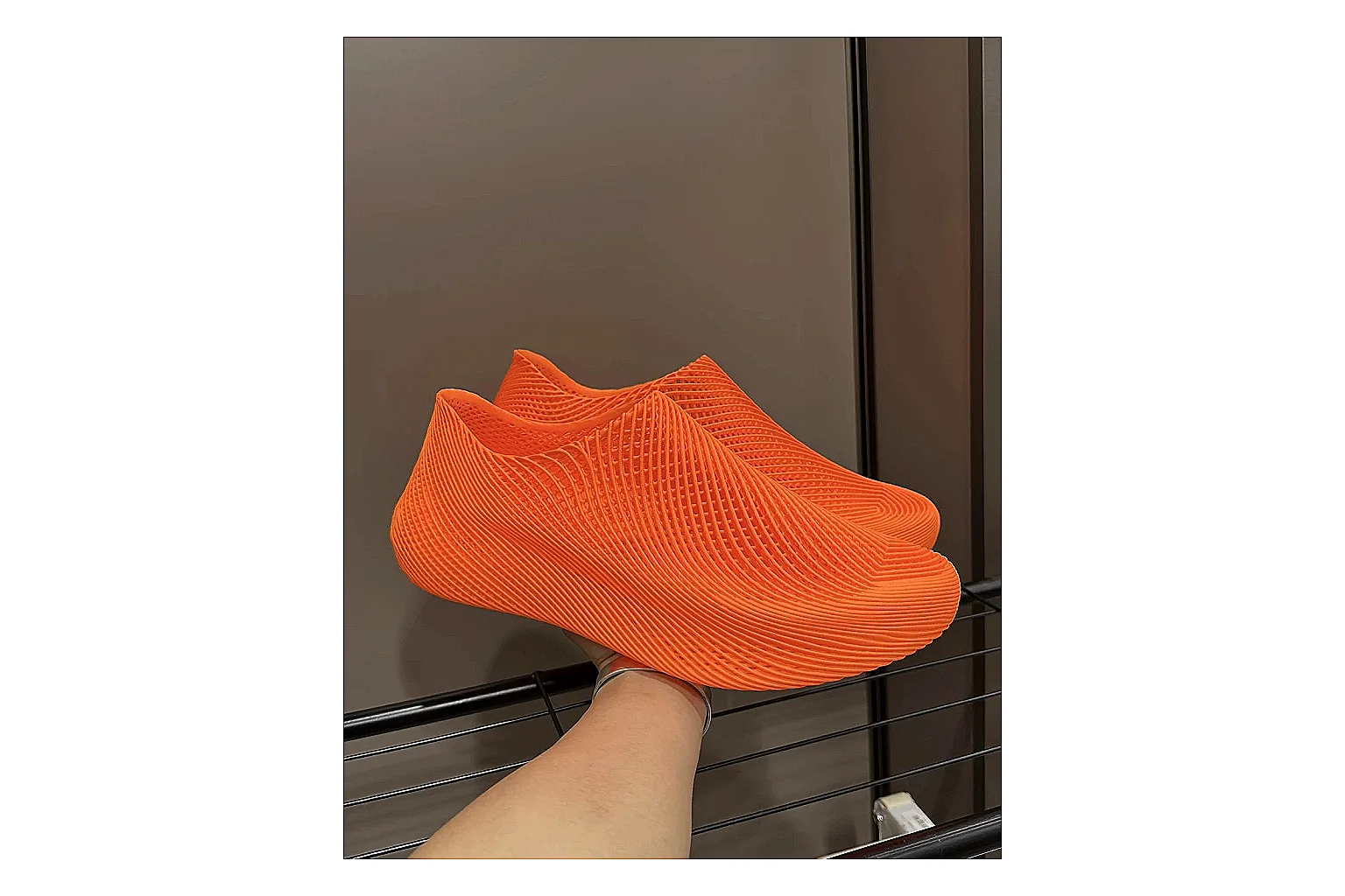 Other 4D Printed Orange Slip-On Sneakers QC reference photo showing orange open-grid upper, seamless slip-on shape, sculpted sole, and futuristic lightweight profile thumbnail 5