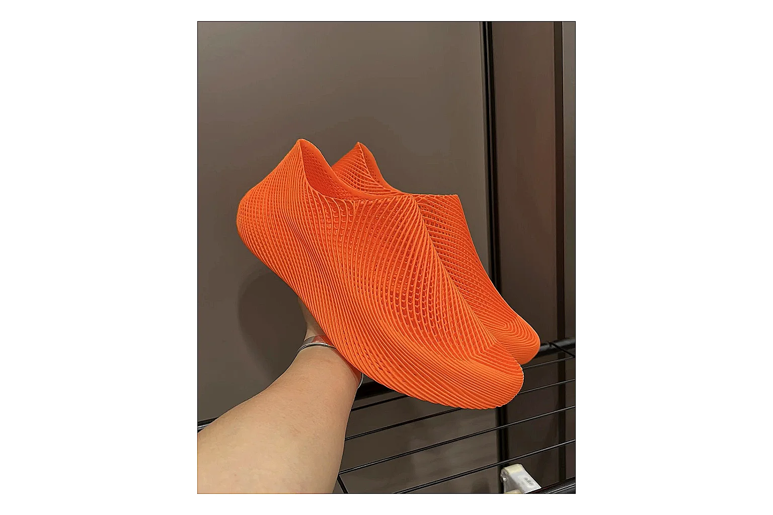 Other 4D Printed Orange Slip-On Sneakers QC reference photo showing orange open-grid upper, seamless slip-on shape, sculpted sole, and futuristic lightweight profile thumbnail 6