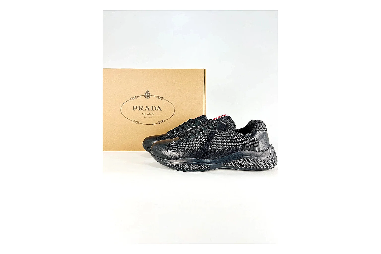Black Runner Black Sneaker QC reference photo showing black mesh runner upper, tonal overlays, modern running shape, and dark cushioned sole