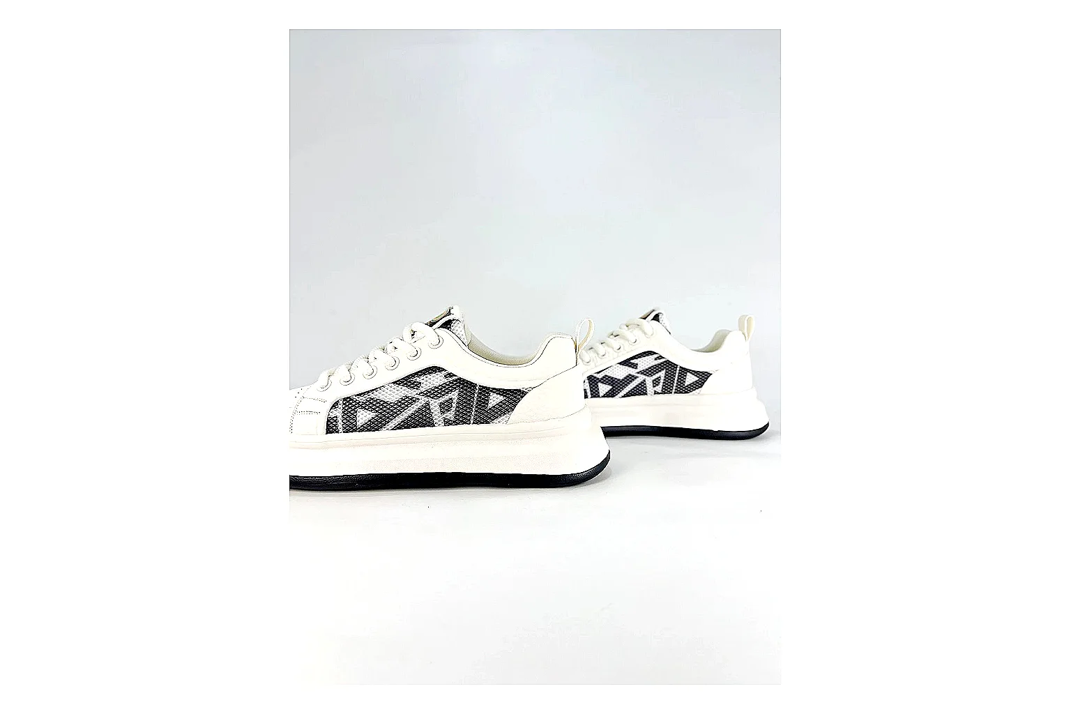 Low Runner White Black Sneaker QC reference photo showing white black synthetic low-top upper, minimal runner shape, clean panels, and casual sole