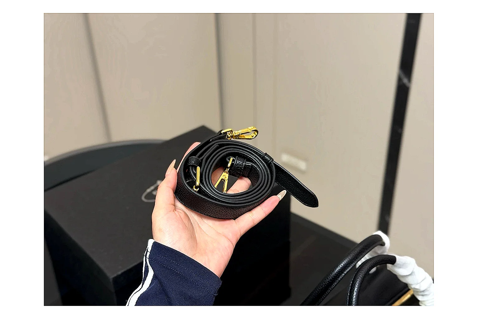 Prada Mini Top Handle Black QC reference photo showing black leather mini bag body, structured top handle, compact silhouette, and clean metal hardware thumbnail 2
