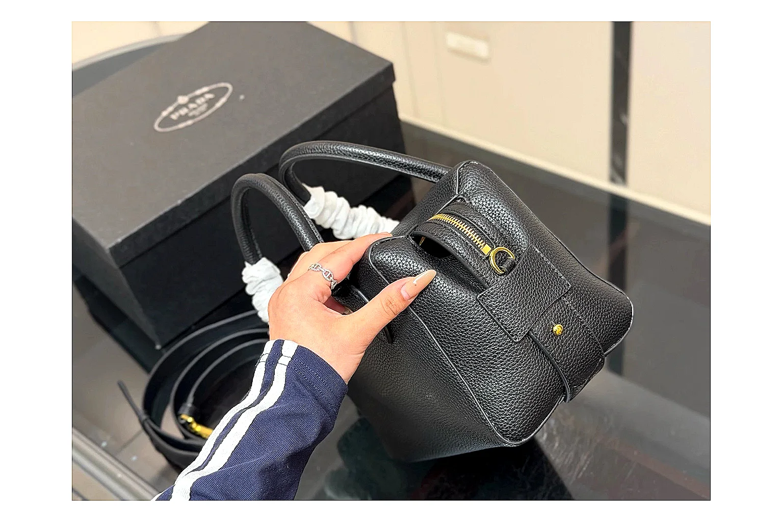 Prada Mini Top Handle Black QC reference photo showing black leather mini bag body, structured top handle, compact silhouette, and clean metal hardware thumbnail 4