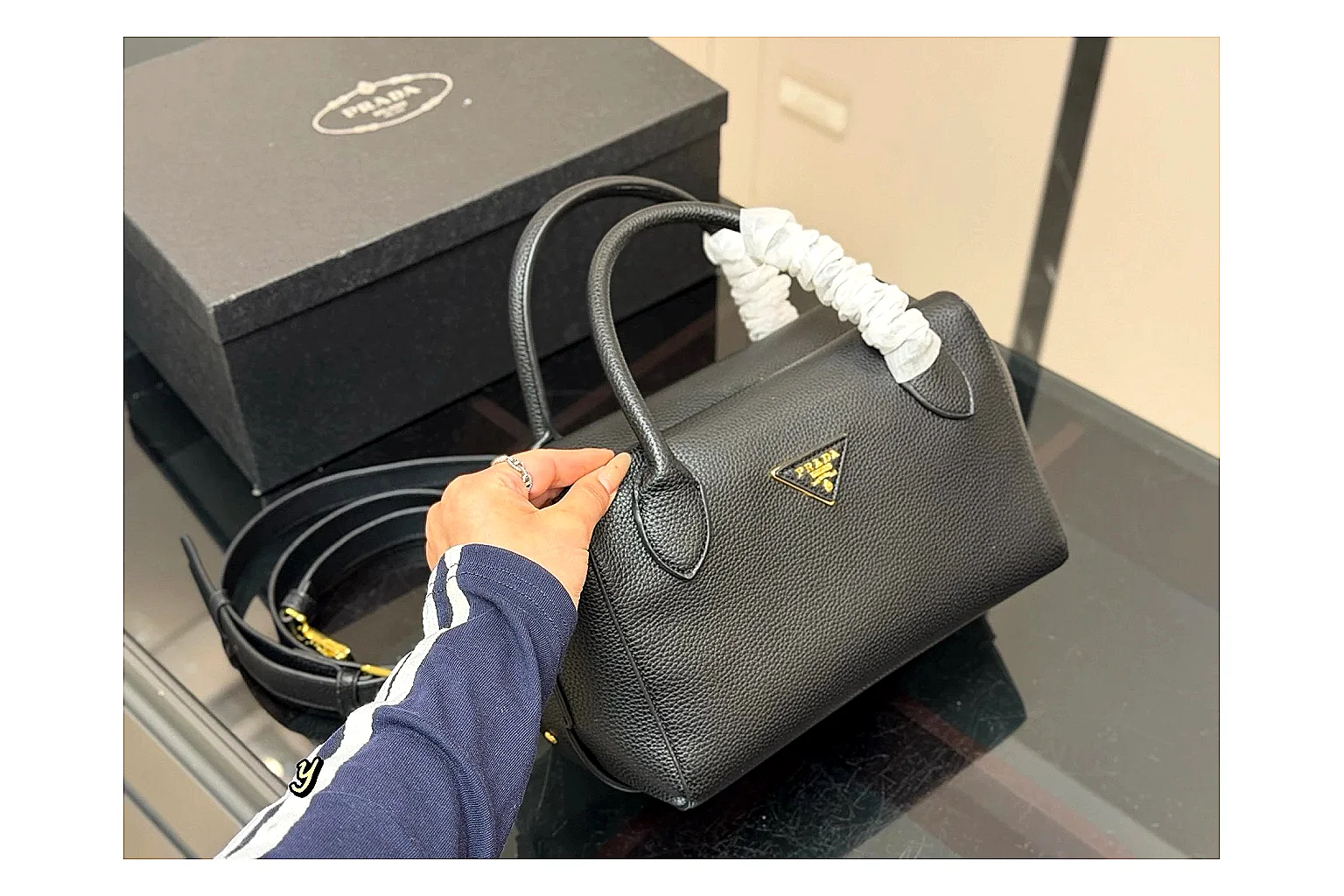 Prada Mini Top Handle Black QC reference photo showing black leather mini bag body, structured top handle, compact silhouette, and clean metal hardware thumbnail 5