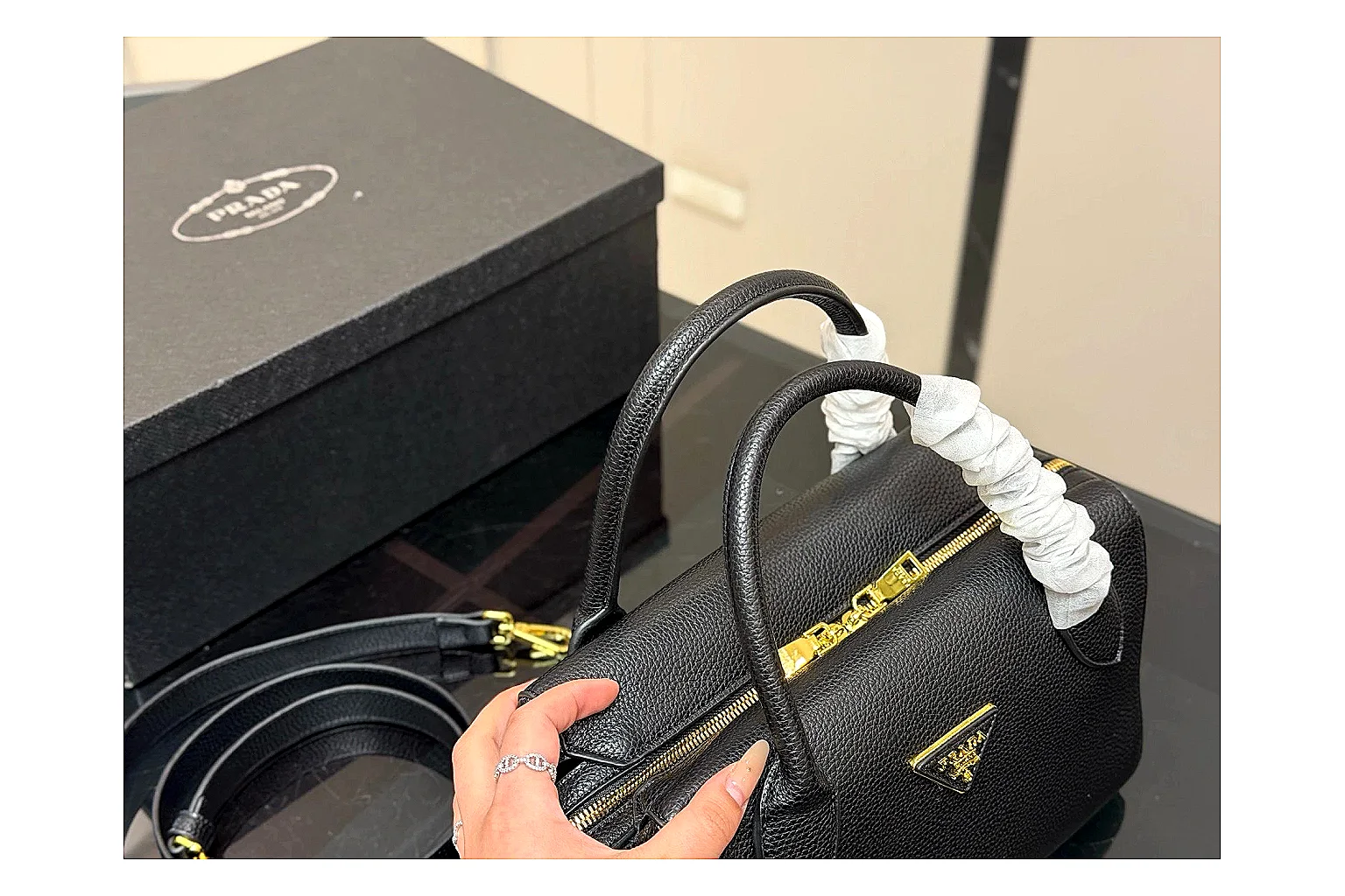 Prada Mini Top Handle Black QC reference photo showing black leather mini bag body, structured top handle, compact silhouette, and clean metal hardware thumbnail 6
