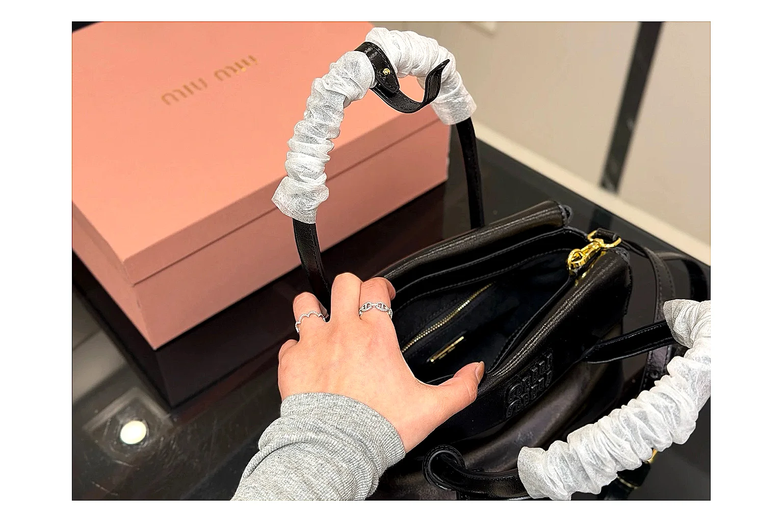 Prada Mini Top Handle Black QC reference photo showing black leather mini bag body, structured top handle, compact luxury shape, and clean hardware details thumbnail 3