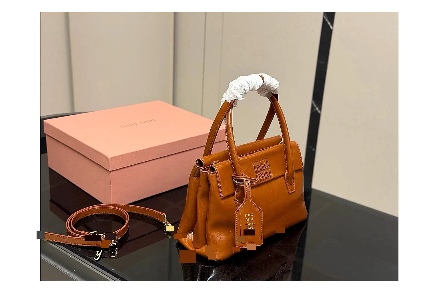 Prada Mini Top Handle Orange Brown QC reference photo showing orange brown leather mini bag body, structured top handle, compact shape, and clean hardware details