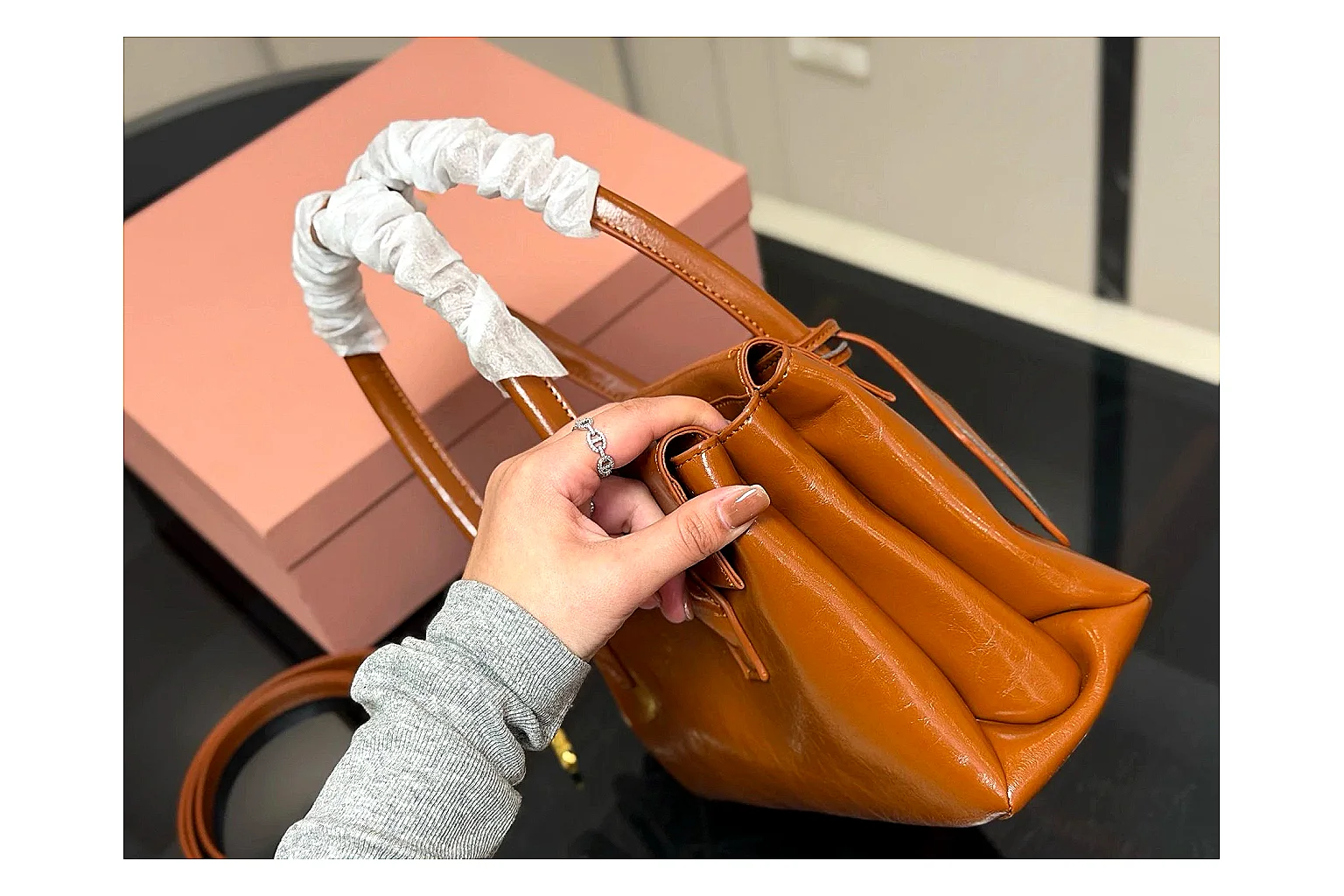 Prada Mini Top Handle Orange Brown QC reference photo showing orange brown leather mini bag body, structured top handle, compact shape, and clean hardware details thumbnail 4