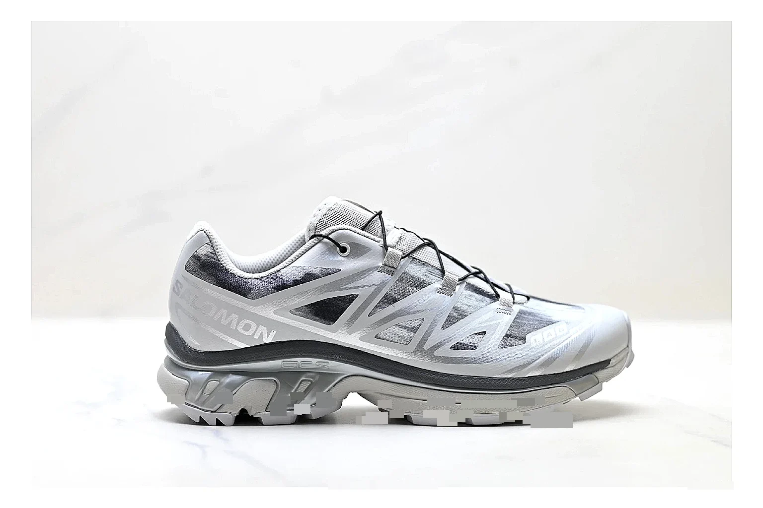 Salomon Xt Runner Silver Gray QC reference photo showing silver gray mesh trail upper, technical runner overlays, speed-lace style structure, and rugged sole