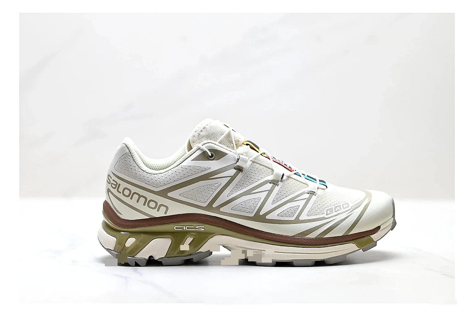 Salomon Xt Runner White Gold QC reference photo showing white mesh trail-runner upper, gold accents, speed-lace style structure, and rugged sole